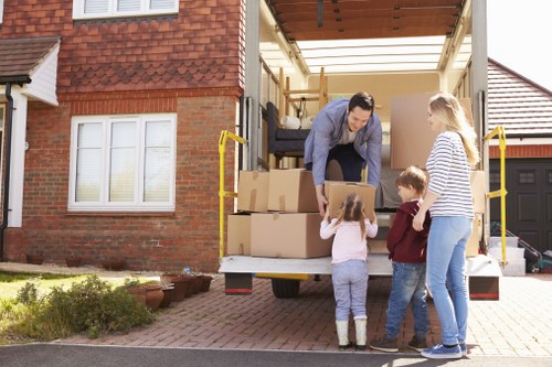 Professional house removals support in Twickenham with moving boxes and furniture