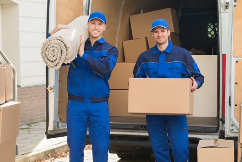 Packed moving boxes and furniture prepared for transport in Twickenham