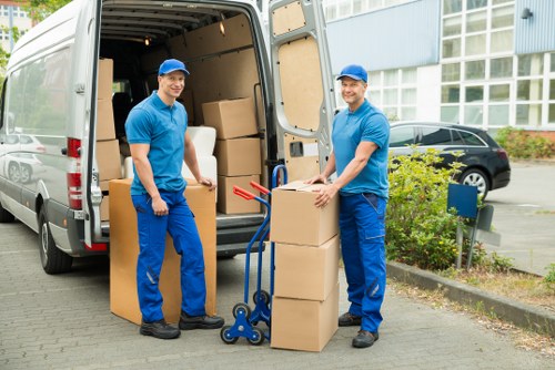 A man and van team discussing access and pricing before a Twickenham move