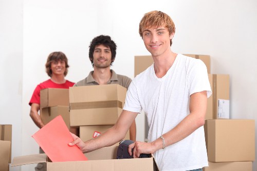 Loading furniture into a removal van on a Twickenham street